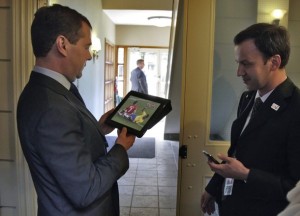 Russian President Dmitry Medvedev watches a World Cup 2010 match between Brazil and Portugal on his iPad before the start of the G8 Summit.